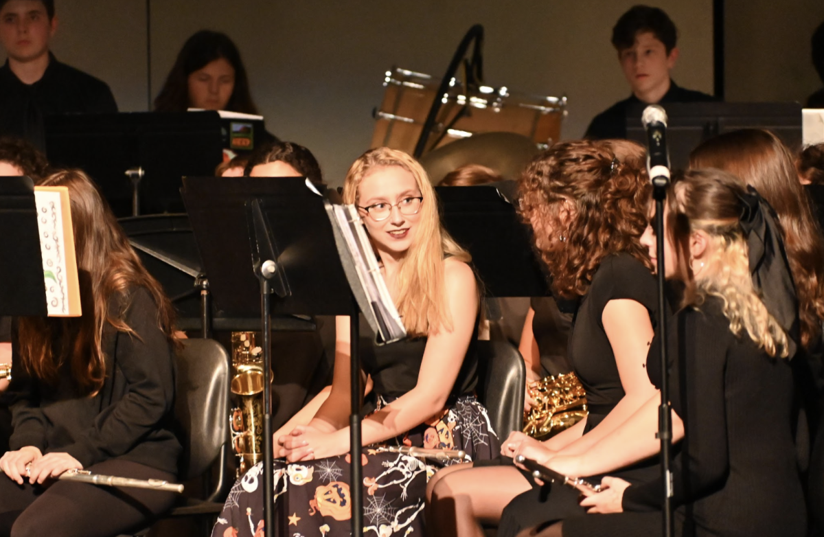 Zoe Mitchell (11) and Abigail Smith (9) chat between songs.